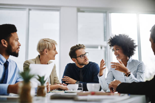 Business professionals giving high-fives in celebration of networking success